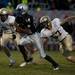 Lincoln senior quarterback Javin Kilgo attempts to evade Chelsea defenders in the first half on Friday. Lincoln lost 41-20. Daniel Brenner I AnnArbor.com